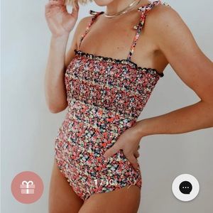 Neon floral smocked one piece swimsuit